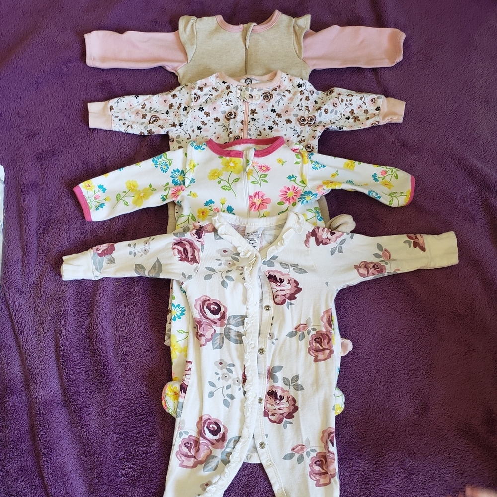 4 pack new very cute girls onesie 0-3 months.